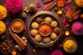 Indian festive Diwali background with sweets. Gulab jamun, carrot halva, snacks with candles, flowers. Assorted Indian desserts. Royalty Free Stock Photo
