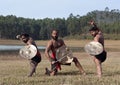 Indian fighters with sword and shield - Kalaripayattu marital art demonstration in Kerala, India