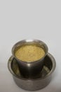 Close up view of Indian filter coffee on white background