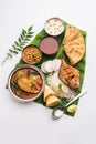 Indian Fish Platter or seafood Thali served in a steel plate or over banana leaf