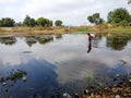 indian fisher girl entering into the river in India January 1, 2020