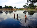 indian fisher kids going into the river in India January 1, 2020