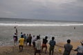 Indian fisher men pulling their net on shore