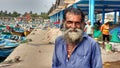 Portrait of old fisherman at harbour Kannur