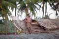 Indian fisherman and the wooden boat Royalty Free Stock Photo