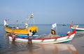 Indian fishermen catching fish for food in wooden boats