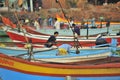 Indian fishermen preparing fishing nets for upcoming voyage