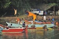 Indian fishermen preparing fishing nets for upcoming voyage