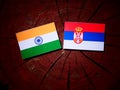 Indian flag with Serbian flag on a tree stump isolated Royalty Free Stock Photo