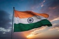 The Indian flag soars proudly against the backdrop of the clear blue sky, Tricolor Indian flag during sunset and a beautiful sky, Royalty Free Stock Photo