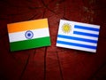 Indian flag with Uruguaian flag on a tree stump isolated Royalty Free Stock Photo