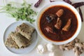 Indian flat bread made of whole wheat flour with grounded flax seed and fresh coriander leaves served with red gravy fish curry Royalty Free Stock Photo