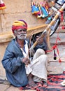 Indian folk artist playing ravanahatha violin at Jaisalmer fort