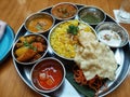 Indian food cuisine set that is complete with condiments