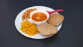 Indian food deep fried Puri Bhaji or Aloo ki Sabji, Potatoes and kheer Royalty Free Stock Photo