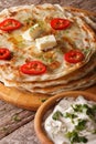 Indian food: hot paratha with butter close-up. vertical Royalty Free Stock Photo