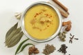 Indian Food- Kadhi with gatte in stainless steel pot with spices.