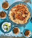 Indian food: Madras beef with basmati rice and salad on the table. horizontal view from above