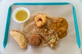 Indian food roti canai with dhal masala vadai, vada, fried egg and curry puff with dhal Royalty Free Stock Photo