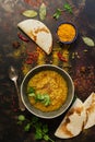 INDIAN FOOD. Thick Indian red lentil soup in the background with spices and homemade bread pita, lavash . Top view Royalty Free Stock Photo