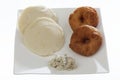 Indian fried snack medu vada & idli with coconut chutney and sambhar.