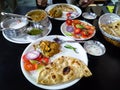 Indian Full course meal served with kadhai paneer,Indian butter roti, spiced curd ,green salad. Restaurant in New Delhi India Royalty Free Stock Photo