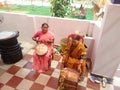 Indian Garhwali women playing Garhwali instrument Dhol Damso