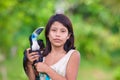 Indian girl with turquoise toucan bird on Amazon River, Brazil