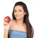 Indian girl with apple Royalty Free Stock Photo