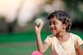 Indian girl child playing with ball Royalty Free Stock Photo