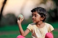 Indian girl child playing with ball Royalty Free Stock Photo