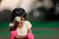 Indian girl child playing with ball Royalty Free Stock Photo