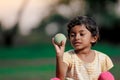 Indian girl child playing with ball Royalty Free Stock Photo