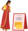 Indian girl in ethnic traditional costume sari stands and reads ad. Asian woman reading announcement