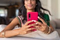 Indian girl in ethnic wear using phone Royalty Free Stock Photo