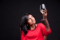Indian girl with a glass of white wine