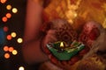 Indian Girl Holding Traditional Oil Lamp