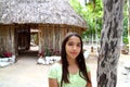 Indian girl in jungle palapa hut house rainforest Royalty Free Stock Photo