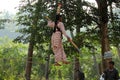 Indian girl performs street acrobatics during the Thaipusam festival