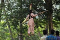 Indian girl performs street acrobatics during the Thaipusam festival