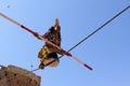 Indian girl performs street acrobatics by walking the rope