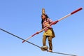 Indian girl performs street acrobatics by walking the rope