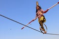 Indian girl performs street acrobatics by walking the rope