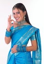 Indian girl in sari saying excellent Royalty Free Stock Photo