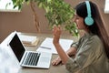 Indian girl student teacher wear headphones giving online class zoom video call. Royalty Free Stock Photo