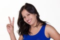 indian girl wearing a blue sleevless t shirt showing victory sign