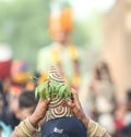 Indian girl welcoming groom with kalasha on her head