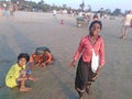 Indian children play in Arambol beach by the evening. Goa, India