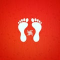 Indian goddess Lakshmi symbol footprint and Swastik over red background