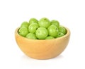 Indian gooseberry in wooden bowl isolated on white background Royalty Free Stock Photo